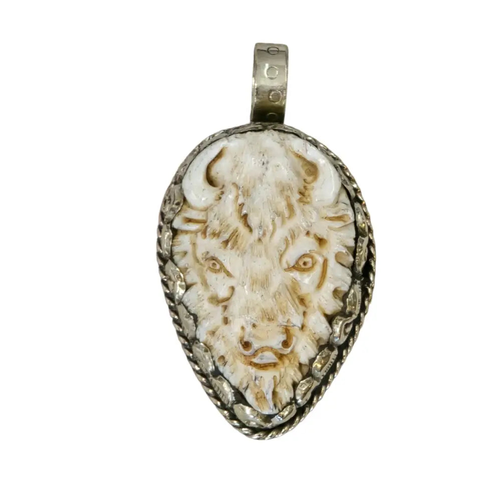 Hand-Carved Natural Bone Buffalo Head Pendant Featuring a Tibetan Silver Design