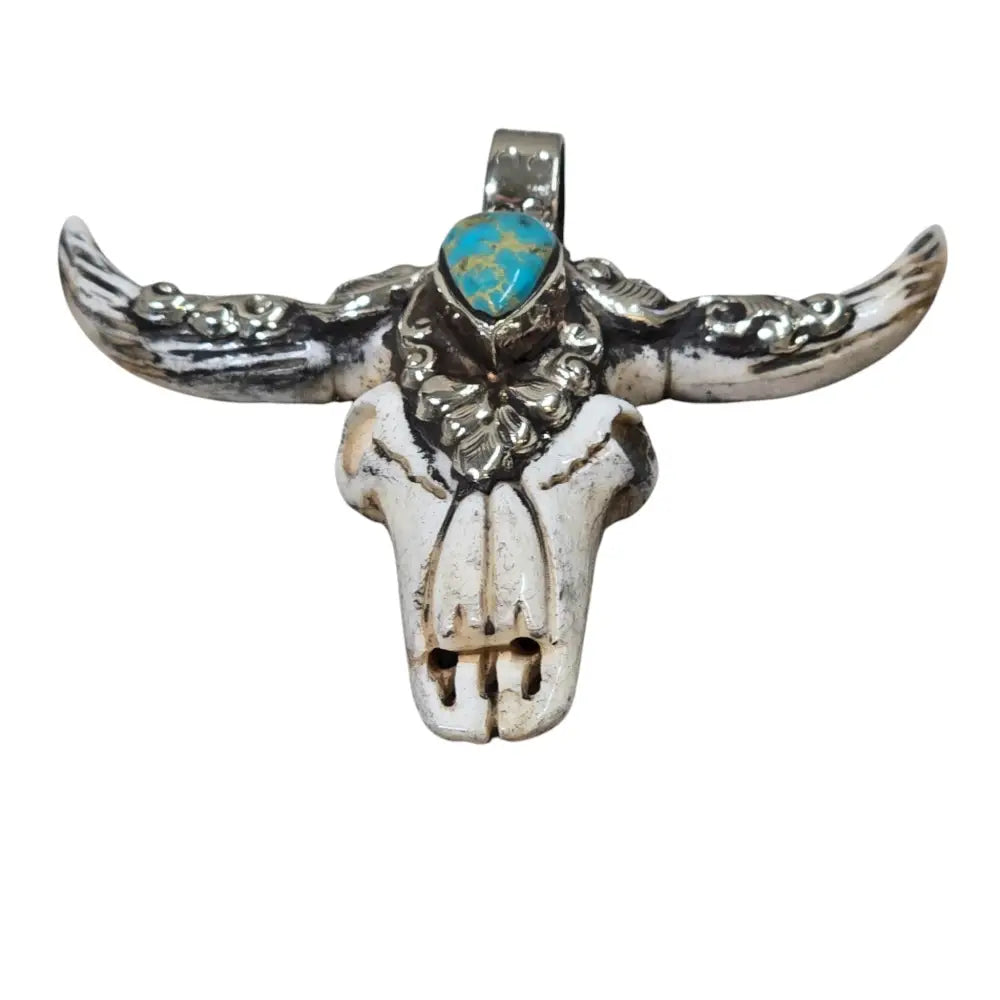 Hand-Carved Natural Bone Longhorn Bull Pendant Adorned with a Tibetan Silver Design inlaid with a Turquoise Stone.