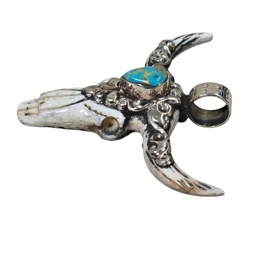 Hand-Carved Natural Bone Longhorn Bull Pendant Adorned with a Tibetan Silver Design inlaid with a Turquoise Stone.